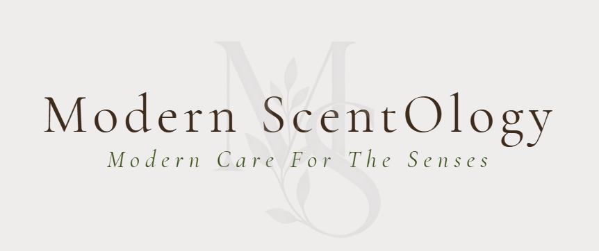The logo for Modern ScentOlogy, featuring the brand name in a dark brown serif font and the tagline 'Modern Care For The Senses' in a green italic font, set against a light gray background with a faint monogram.