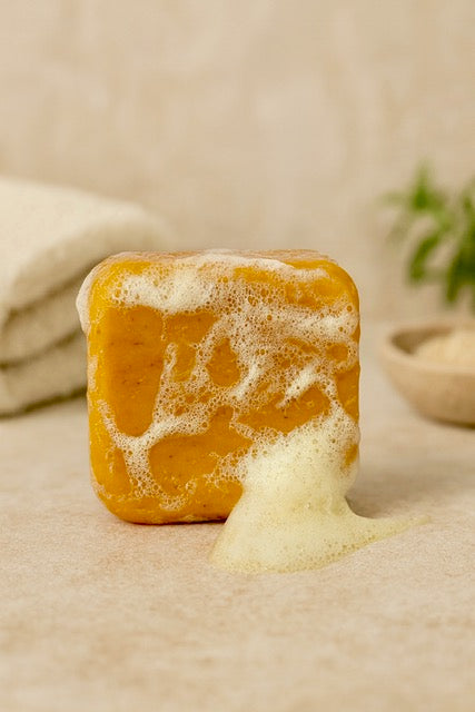 Turmeric & Ginger Radiance Renewal Set: Includes a handcrafted cleansing soap, on neutral background